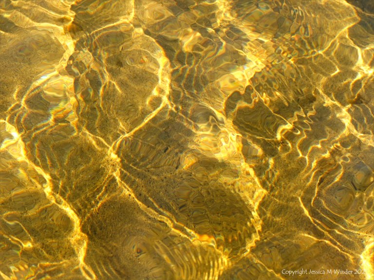 Natural patterns of reflected light on a stream