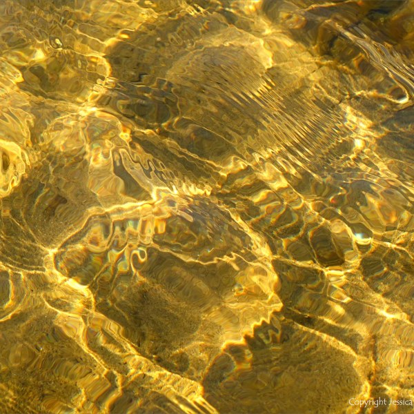 Natural patterns of reflected light on a stream