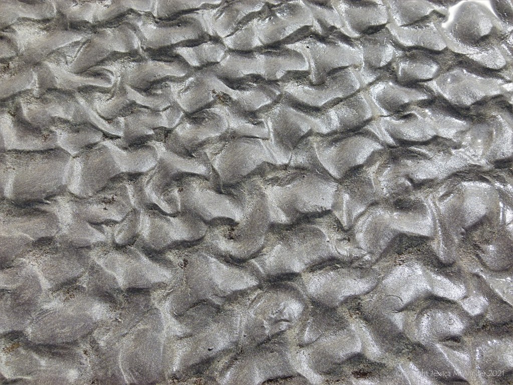 Ripple texture patterns in sand on the seashore