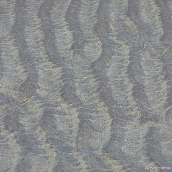 Natural sand ripples left by the tide on the beach