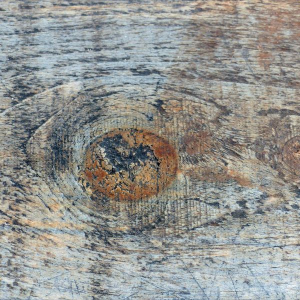 Natural abstract wood pattern and texture on wet picnic table