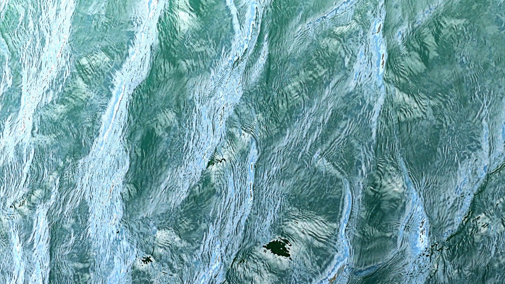 Natural abstract patterns of water surface texture on the sea